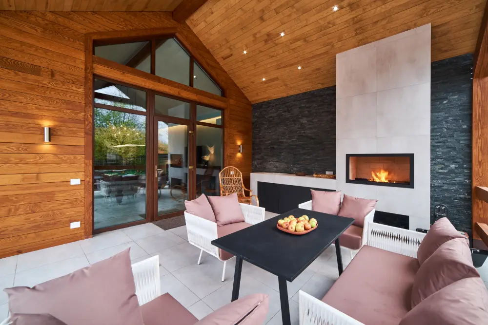 an-open-terrace-with-table-chairs-fireplace-and-2025-03-15-08-48-23-utc